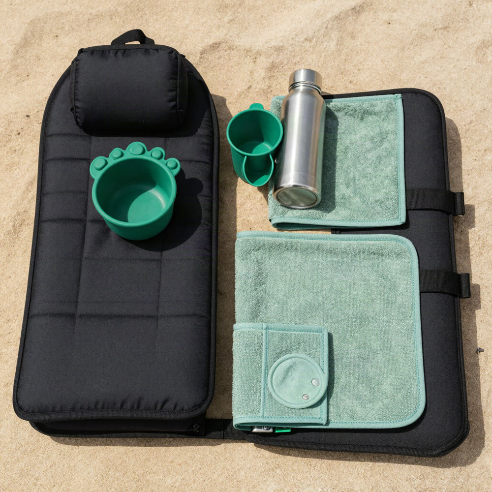 Illustration of the Road Trip Kit: hammock, paw cup, towel and bottle