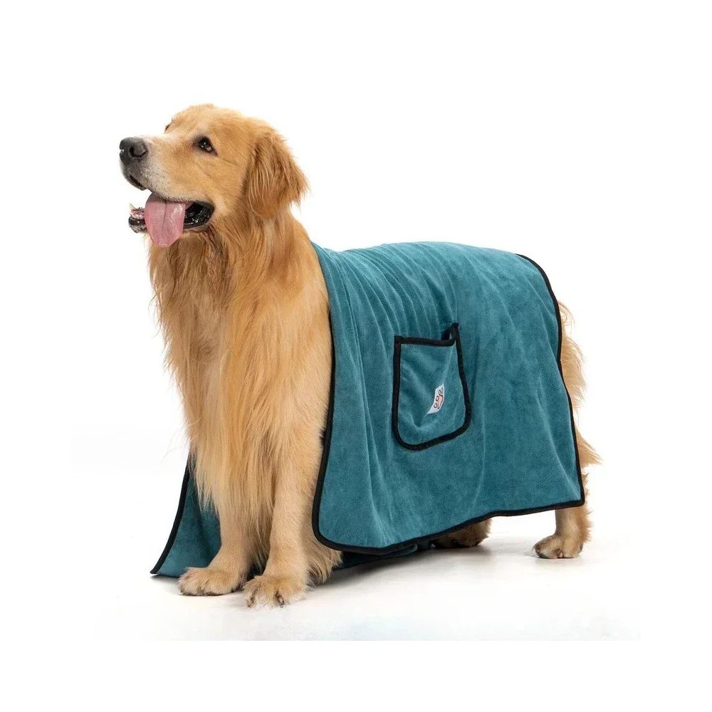 A golden retriever with the Quick-Dry Towel draped over its back, the hand pocket showing